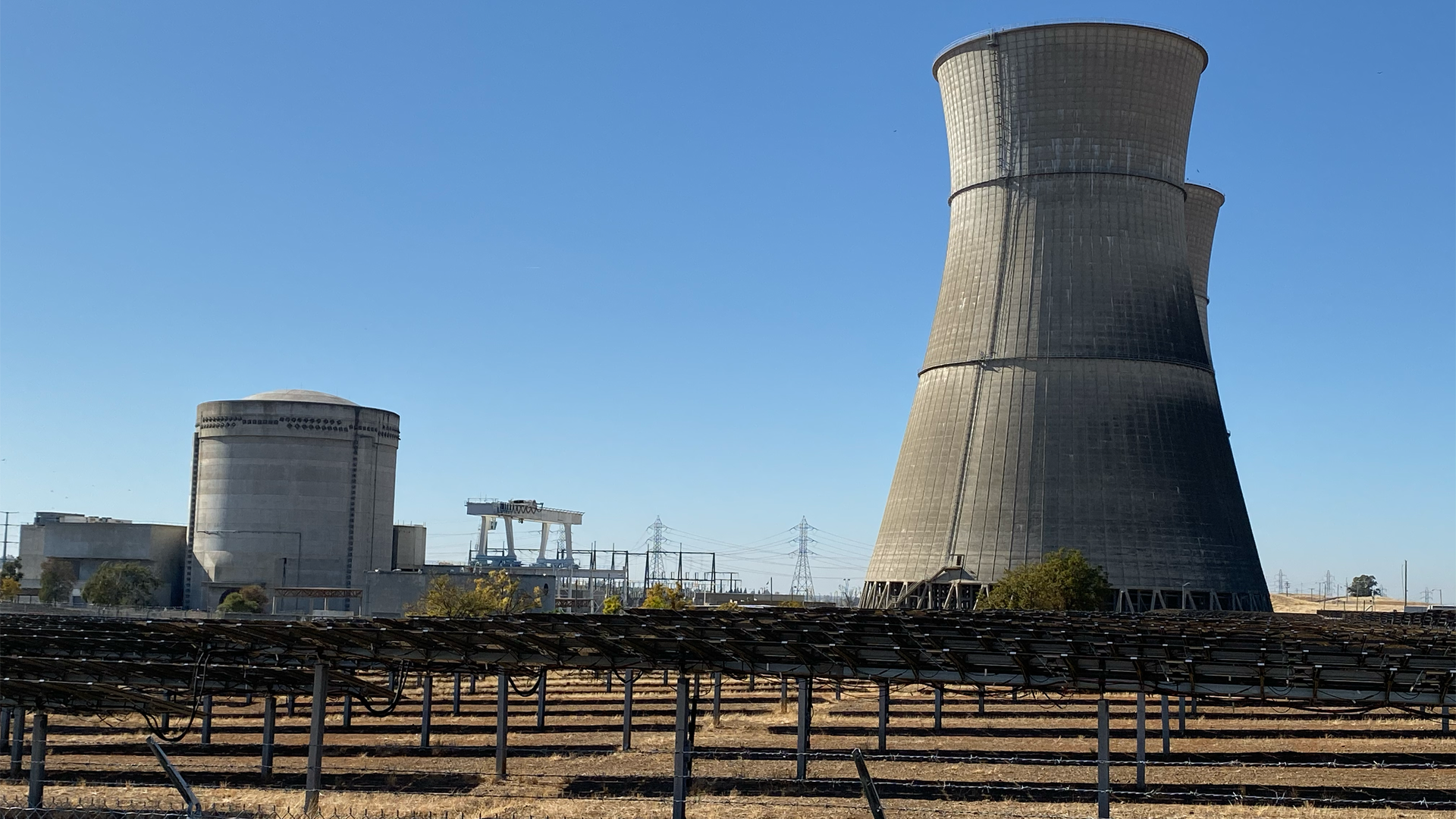 Rancho Seco with solar panels in the foreground and the remaining nuclear structures in the distance