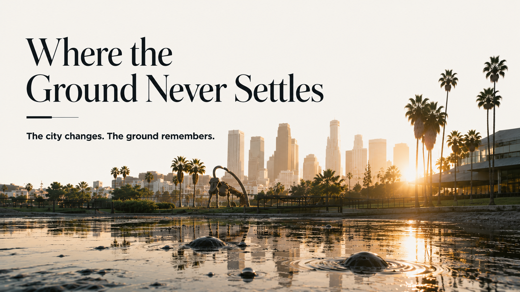 The La Brea Tar Pits at sunrise with the Los Angeles skyline beyond.